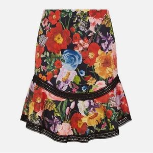 Alice + Olivia Eriko Floral Curved Hem Lace Trim Skirt in Blooming Garden